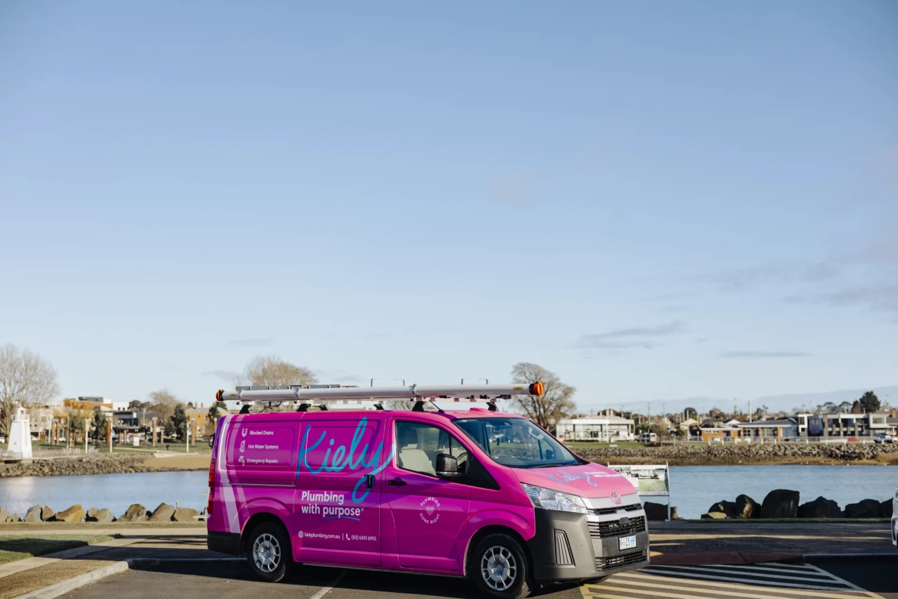 Kiely Plumbing service van beside the Mersey River in Devonport — local plumbers servicing Stony Rise TAS